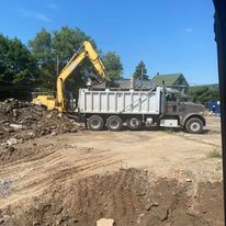 Excavator Filling a Dump Truck